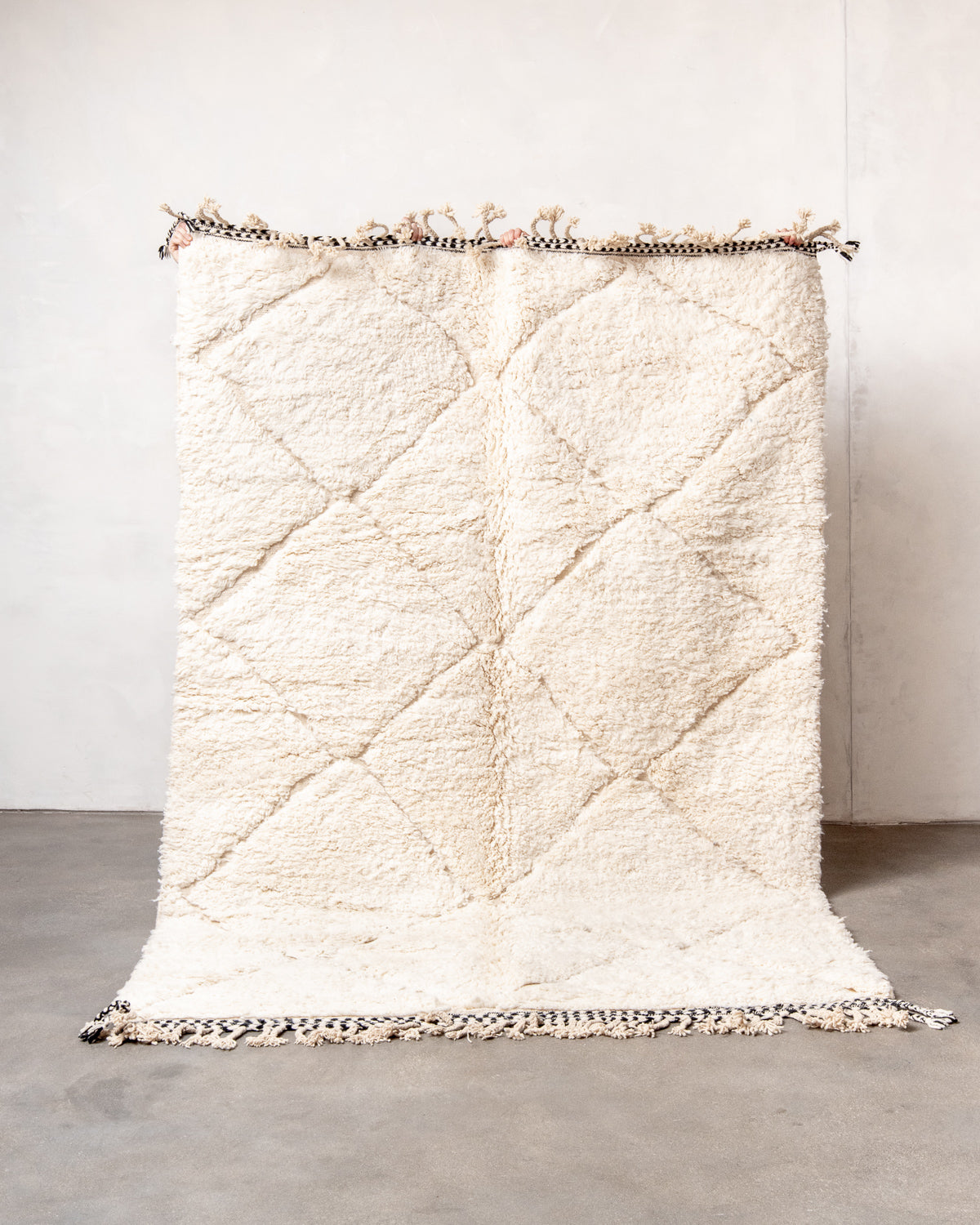 Modern, designer, handcrafted Berber rug from Morocco. Beniourain carpet with minimalist design, natural wool pile and a fluffy texture.